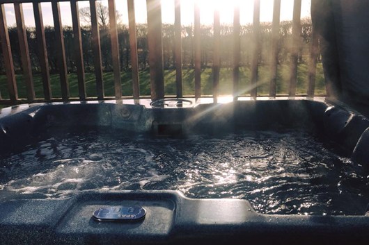 Private hot tub sunken into the veranda
